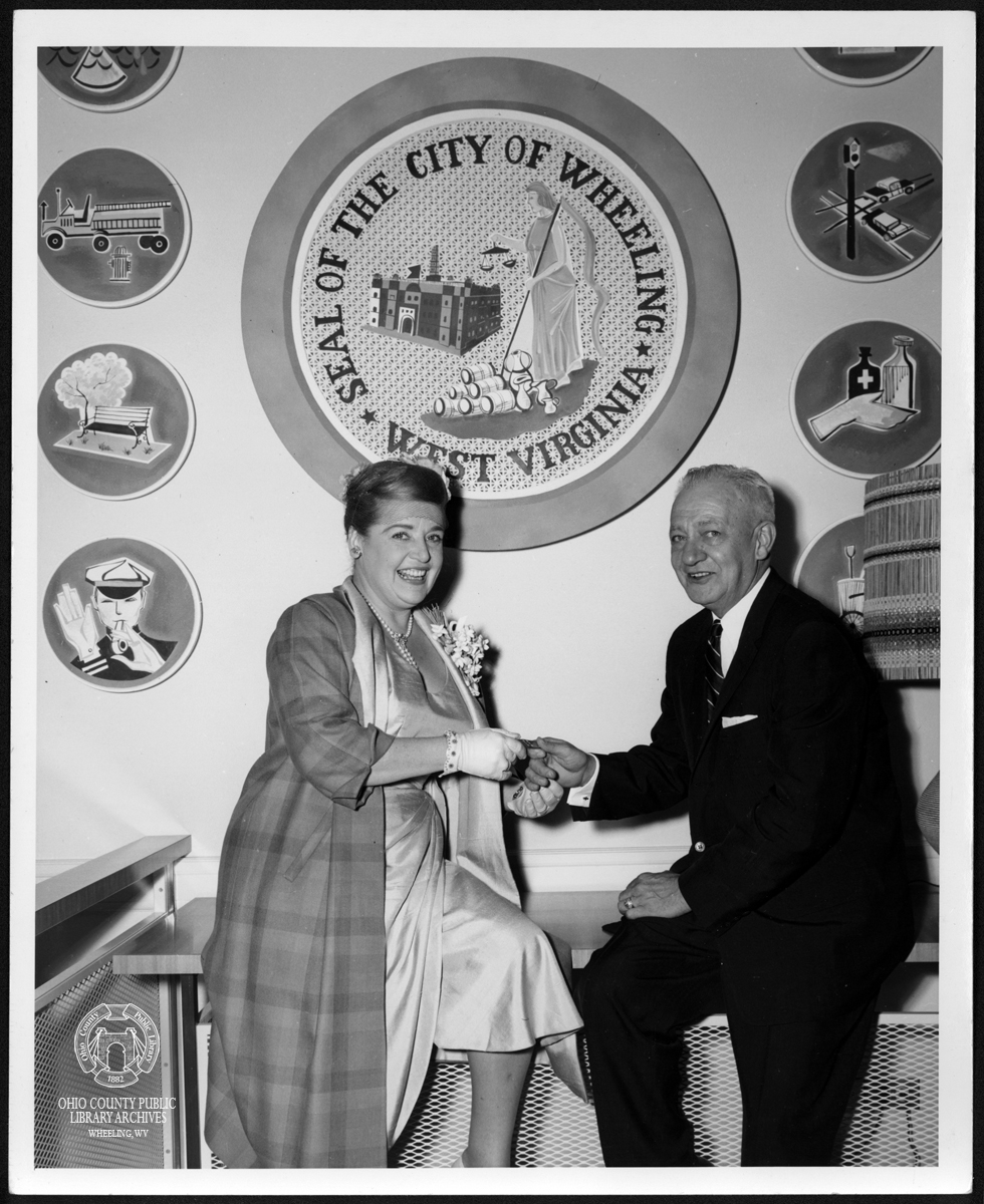 Eleanor Steber and Wheeling Mayor John J. Gast under the City Seal, 1960.