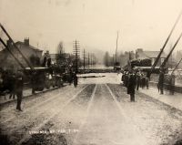 The Island end of the Suspension Bridge, looking straight down Virginia Street, during the flood of 1884 which reached the unprecedented stage of 52 feet.