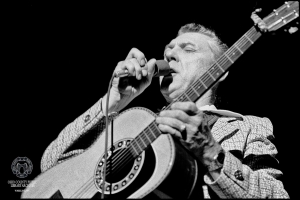 Dave Dudley On Stage at Capitol Theatre During Truckers Jamboree. Photo By Bill Burke. Photo Copyright Owner: Bill Burke. Photo from the Ohio County Public Library Archives.