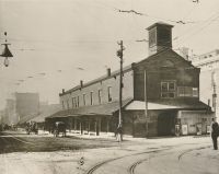 The Market House and Town Hall cost $690. The Town Hall rooms were located on the second floor and slaves were bought and sold at this end.