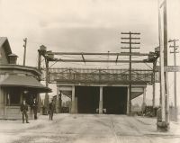 The Bridgeport entrance to the covered bridge over the back river. Notice the raised railroad crossing gate in the center.