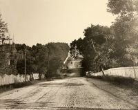 Looking east on National Road. In the left foreground is Mount Calvary Cemetery. Wheeling Park stands in the distance to the left.