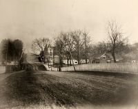 A spring view of National Road at Mount Calvary, looking east showing Stamm House at the top of the hill.