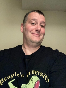 Seen here in his official People's University Dinosaurs tee-shirt, paleontologist Dr. Matthew Lamanna led the museum tour.