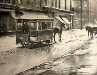 Martin's Ferry and Benwood Ferry in a rainstorm on Market Street near 12th when horse cars were the principle public transportation. Notice the flagstone walks and muddy streets. This was Wheeling in 1885.