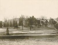 Monument Place, Elm Grove, showing the old stone barn and the roof of the slave quarters.