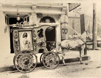 The advertising wagon and the beautiful white horse of the Grand Opera House.