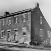 BROWN PHOTO #15: Double house supposed to have been built by the Zane brothers in 1837, for the toll keepers of the wooden bridge that spanned the back river. It stood on Zane Street.